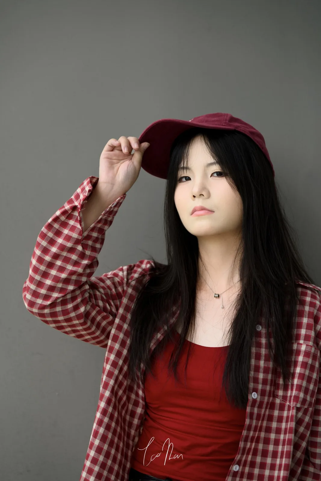 A portrait in red against a grey background
