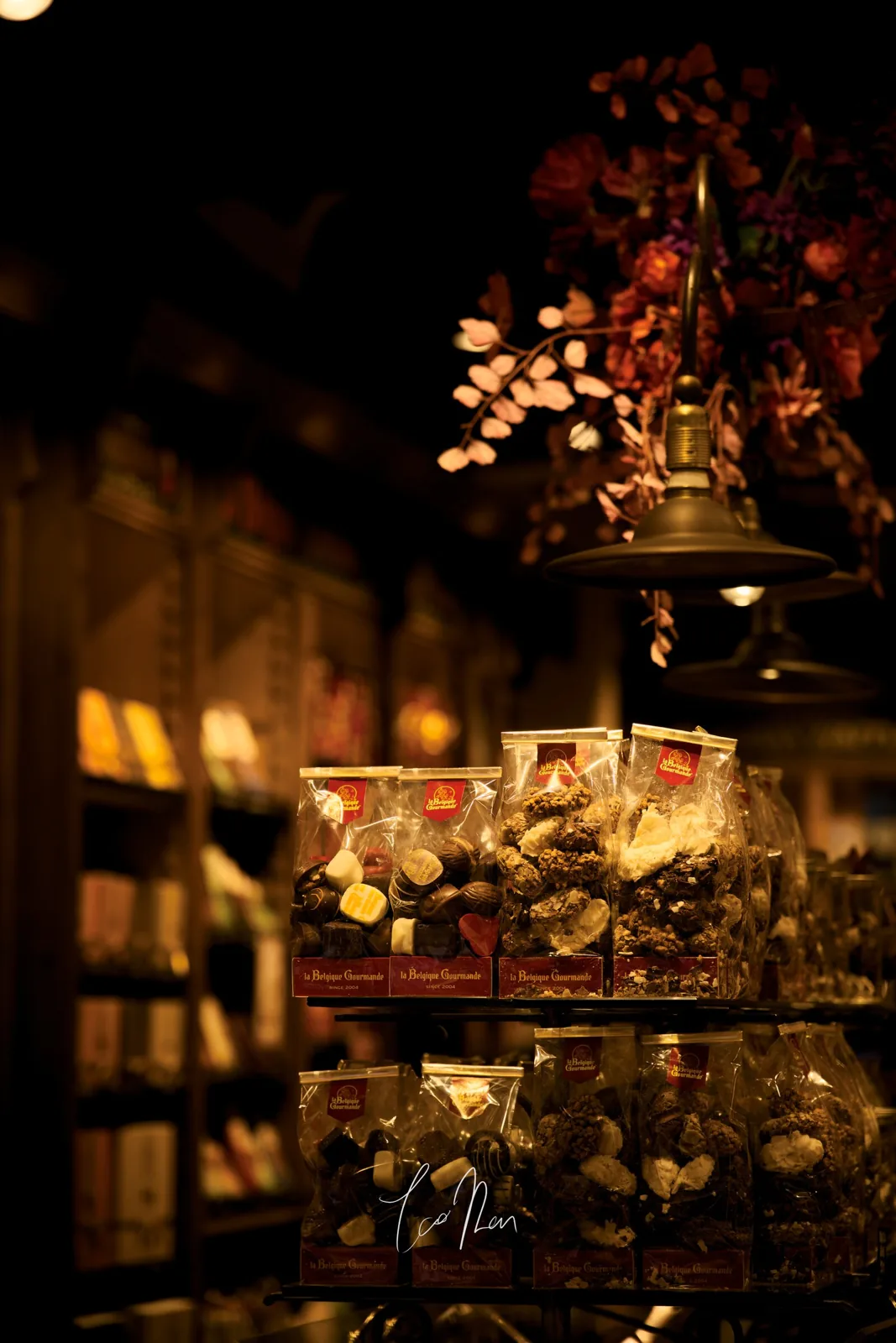 A warmly lit shop window at night