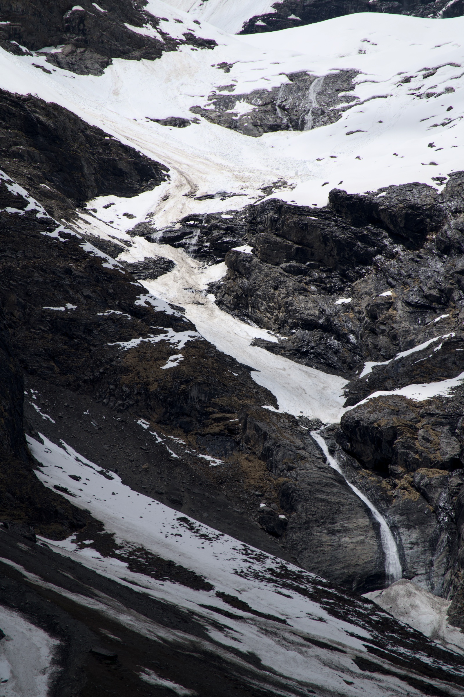 Melting snow flowing through the rocks