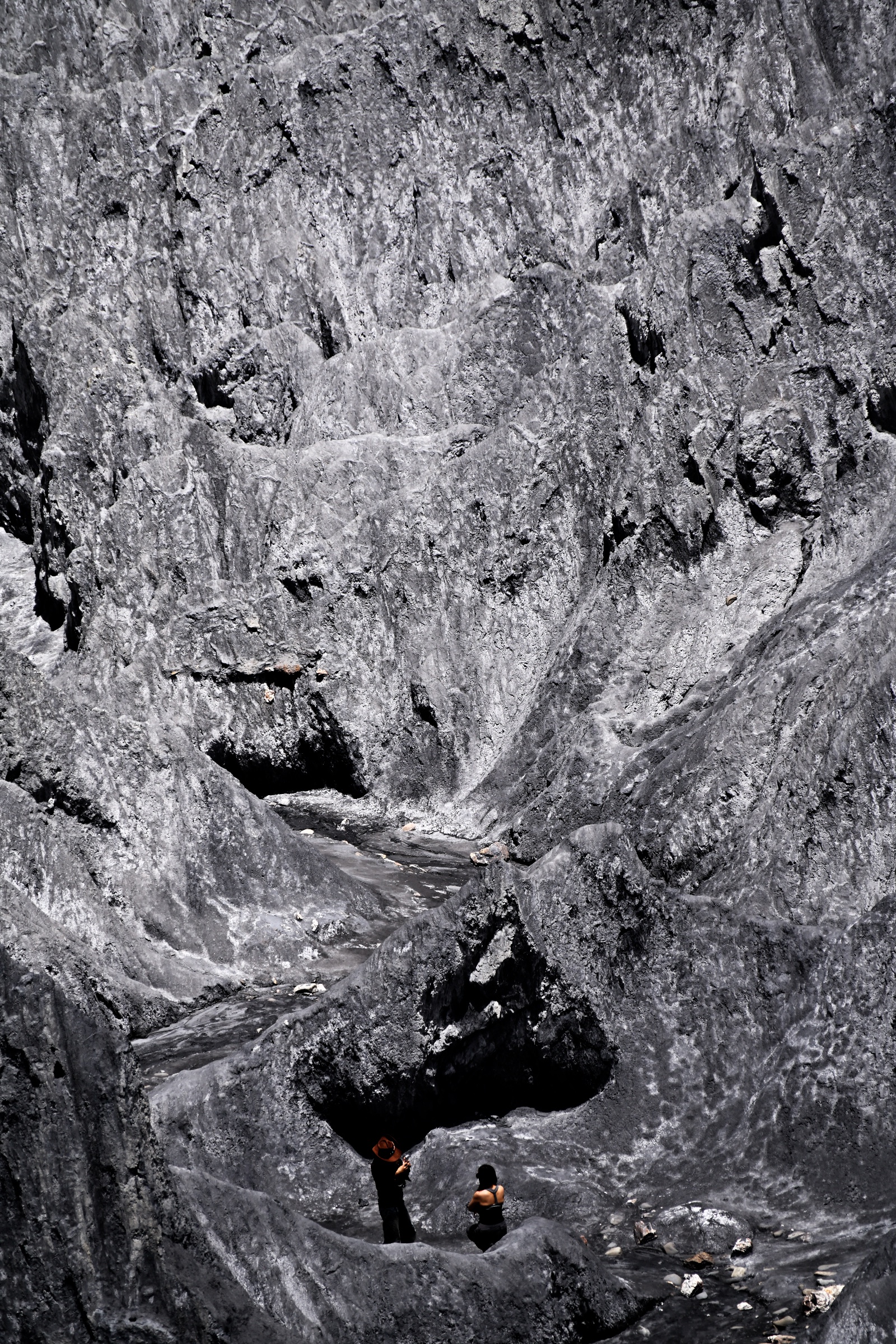 A record of humans recording themselves in rocky terrain